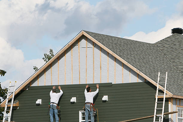 Professional Siding Installation technician working in Beech Bottom, WV